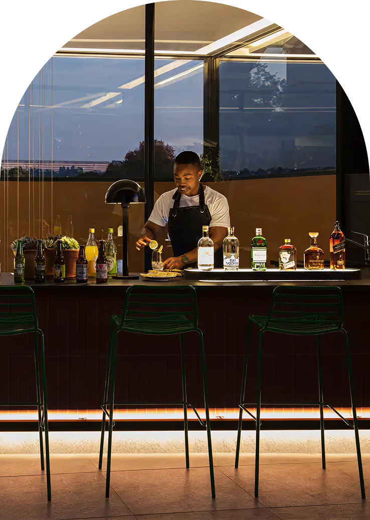 Bartender preparing cocktails at Home Suite Hotels Rosebank