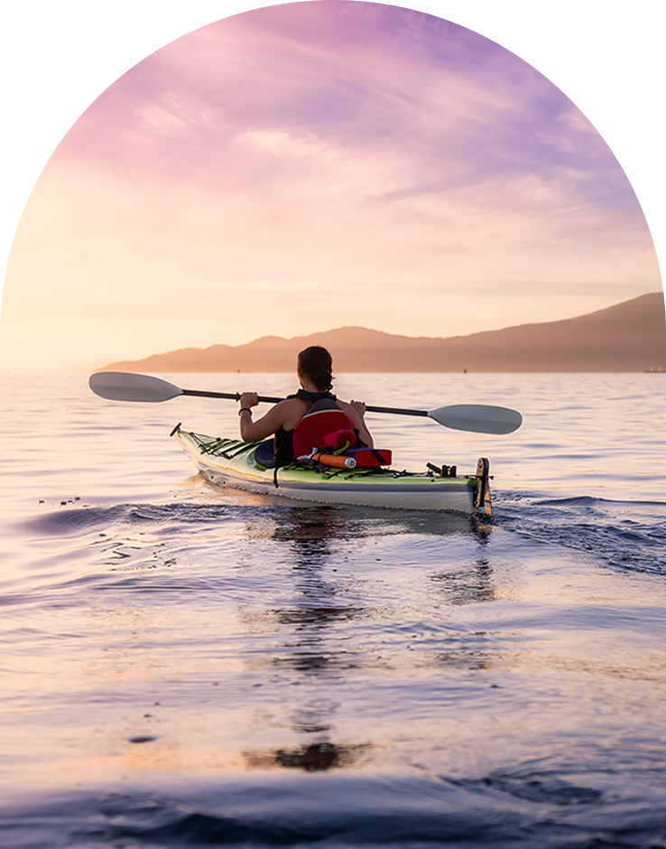 Guest kayaking off the Cape Town coast at sunset