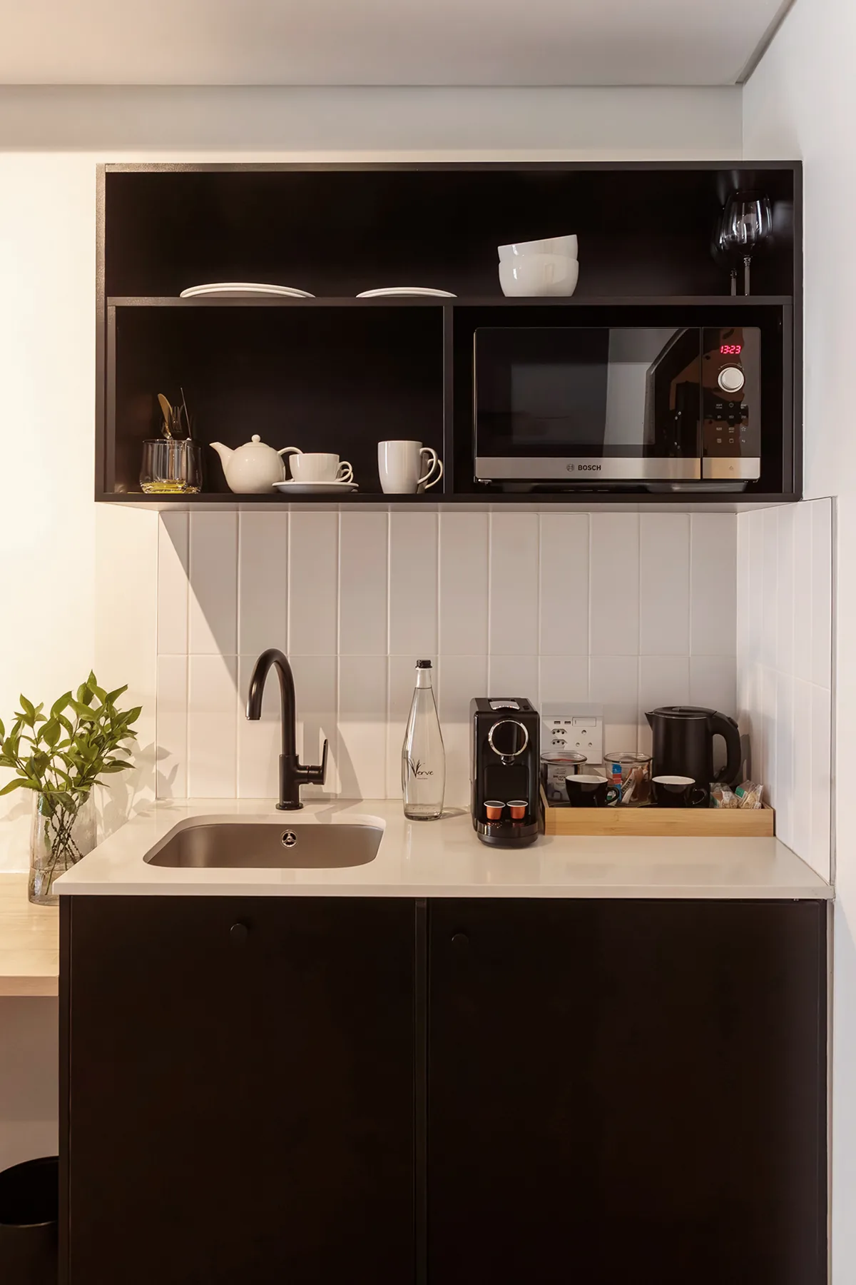 In-suite coffee station and kitchenette at Home Suite Hotels Station House